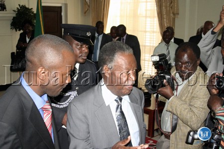 cabinPresident Michael Sata is accompanied by the newly appointed State House Special Assistant for Press and Pubic Relations George Chellah (left) at State Houseet 4