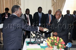 President Michael Sata receives an affidavit from newly appointed Minister of Justice Sebastian Zulu at the swearing-in ceremony at State House President Michael Sata receives an affidavit from newly appointed Minister of Justice Sebastian Zulu at the swearing-in ceremony at State House