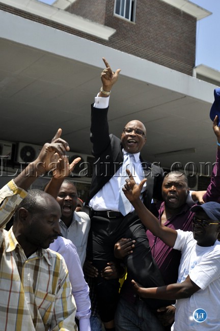 Dr Nevers Mumba is lifted shoulder high by his supporters