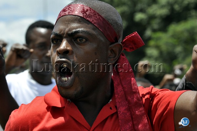 A Patrotic Front youth gestures during the Youth day march past A Patrotic Front youth gestures during the Youth day march past