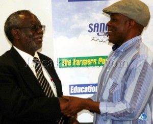 Information Minister Fackson Shamenda (l) and Post newspapers owner Fred Mmember clench hands after a meeting in Lusaka Information Minister Fackson Shamenda (l) and Post newspapers owner Fred Mmember clench hands after a meeting in Lusaka