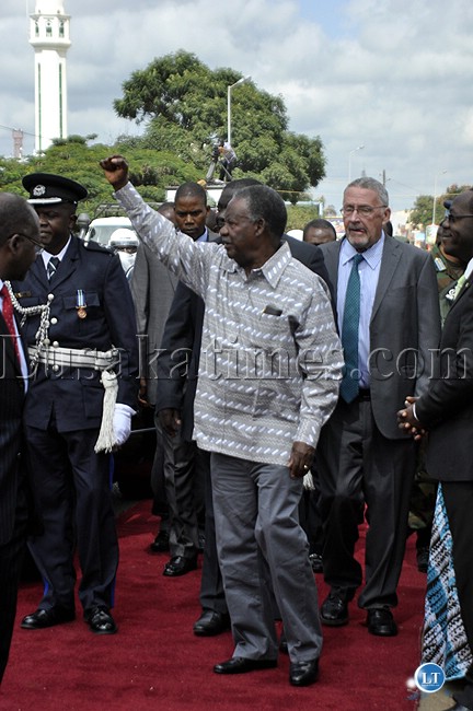 President Michael Sata lifts a clenched hand for his supporters President Michael Sata lifts a clenched hand for his supporters