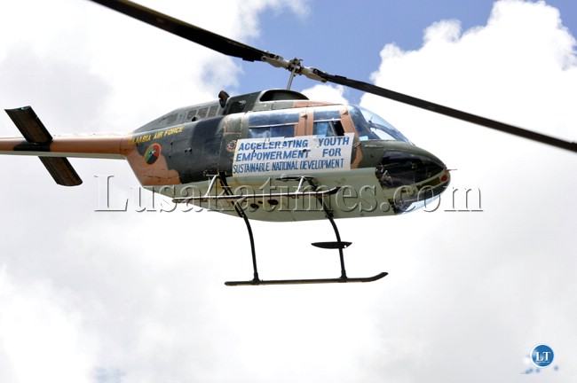 The Zambia Air Force chopper flies past with the Youth Day theme The Zambia Air Force chopper flies past with the Youth Day theme