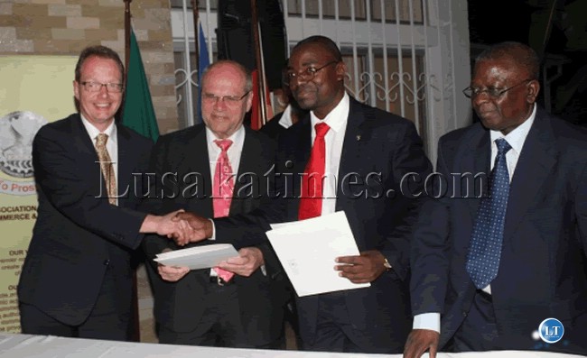 ZACCI Dr. Chabuka Kaweshi (red tie) Vice President ZACCI and Mr. Handson Sindowe(r) , immediate past president of ZACCI pose for a picture with Frankfurt Chamber is Chamber President Mr. Bernd Ehinger(c) and German Ambassdor to Zambia Frank Meyek(l) at the Frankfurt Chamber Partnership Project Signing Ceremony held at the German ambassadors residence on 29th February.Picture by Jean Mandela