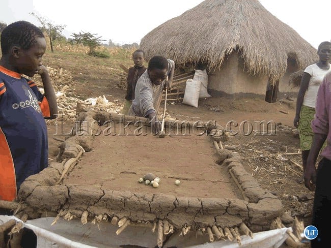 A game of pool in a village in rural Zambia.Courtesy of UNHCR Zambia