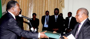 President Sata receiving the commissioner of inquiry report into the cancellation of radar contracts