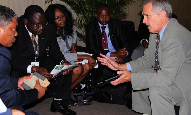 Foreign Affairs and Tourism Minister Given Lubinda (left), Lands, Water and Enviromental Protection Minister Wylbur Simuusa, Zambia?s Permanent Representative to the UN Dr Mwaba Kasese-Bota (middle) listening to an investor Glenn Camp about cheaper housing project. Foreign Affairs and Tourism Minister Given Lubinda (left), Lands, Water and Enviromental Protection Minister Wylbur Simuusa, Zambia?s Permanent Representative to the UN Dr Mwaba Kasese-Bota (middle) listening to an investor Glenn Camp about cheaper housing project.