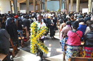 casket leaving cathedral