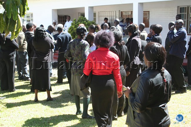 Civil Servants wait for Inutu Suba to come out of her office at the provincial administration offices in Kabwe