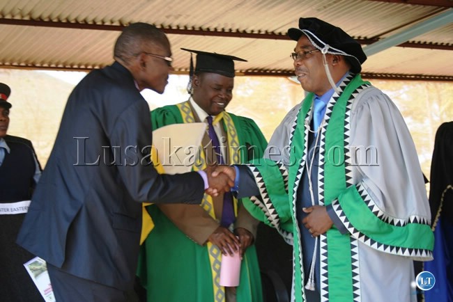 EASTERN Province Minister, Charles Banda, shakes hands with University of Zambia Vice Chancellor, Professor Stephen Simukanga EASTERN Province Minister, Charles Banda, shakes hands with University of Zambia Vice Chancellor, Professor Stephen Simukanga