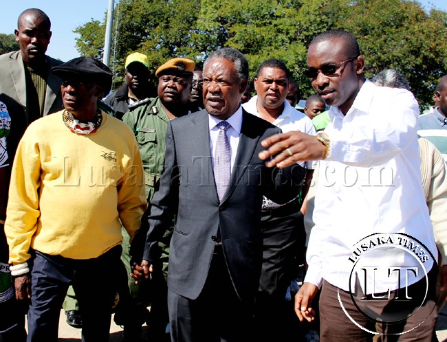 President with his spokesperson George Chellah (r) and Chief Mukuni (l) when he arrived in Livcingstone for political campaigns President with his spokesperson George Chellah (r) and Chief Mukuni (l) when he arrived in Livcingstone for political campaigns