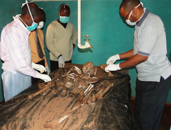 Chinsali mortuary The remains of Mulongwe were found in the bush in Isoka district after missing for 7 months Muchinga Province acting medical officer Dr. Charles Chungu (l) and Dr. Kamina Kabongo (r) with state police examine the remains of Kapwepwe basic school senior teacher Lawrence Mulongwe, 36,at Chinsali mortuary. The remains of Mulongwe were found in the bush in Isoka district after missing for 7 months
