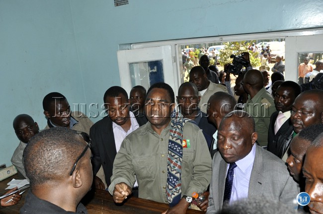 Hakainde Hichilema with ADD leader inside Woodlands police station