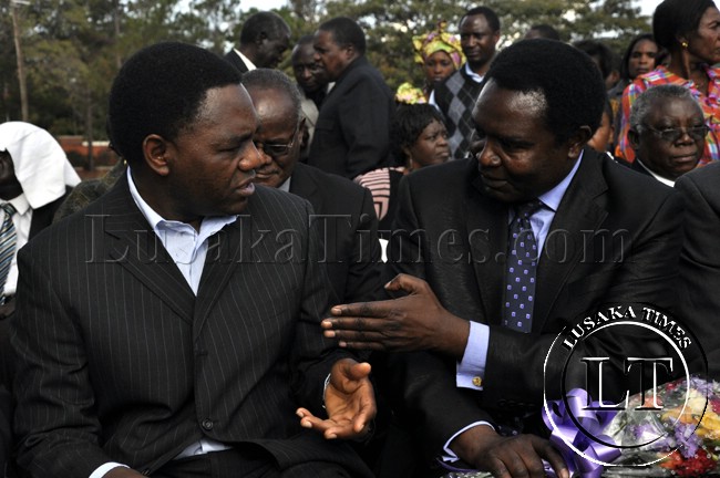 Heritage Party president Godfrey Miyanda and his counterpart from the UPND Hakainde Hichilema confer