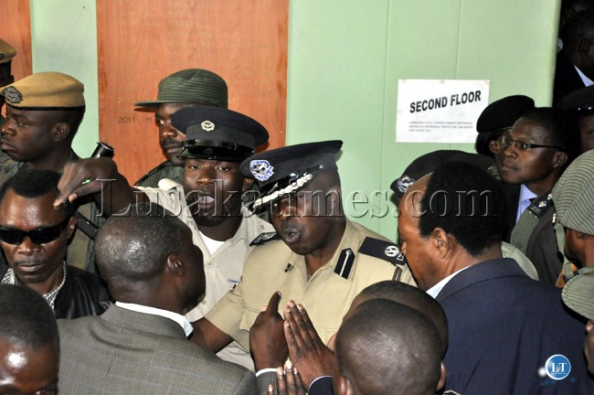 Police officers try to reason with each other Police officers try to reason with