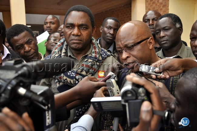 UPND president Hakainde Hichilema and MMD leader Nevers Mumba talks to journalists after Hichilema's court appearance