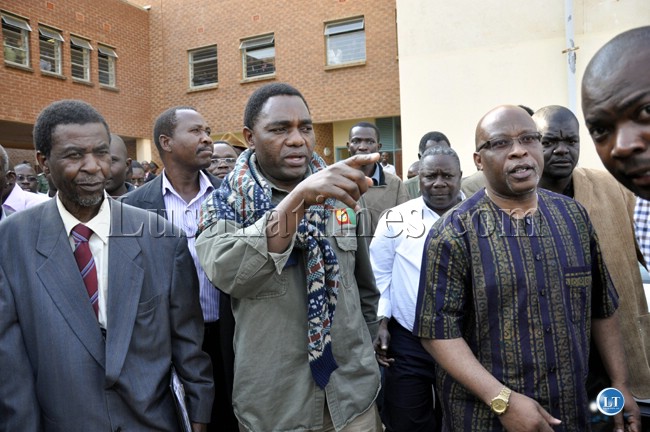UPND president Hakainde Hichilema with his counterparts from Nevers Mumba from MMD and Edwin Sakala from Zambia Direct Democracy Movement (left).