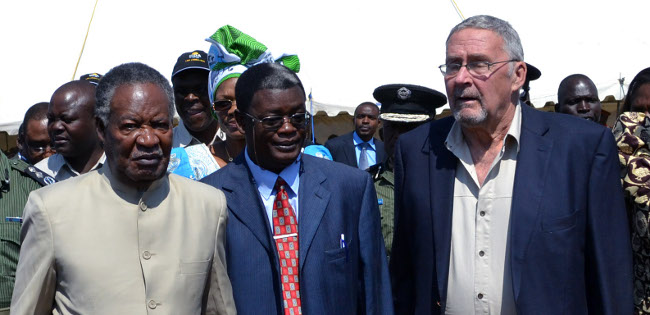 Opposition UPND Livingstone Member of Parliament Howard Sikwela sandwiched between PF 1 and 2-President Michael Sata and Vice President Guy Scott when he launched the Link Zambia-8000 road project in Lusaka today