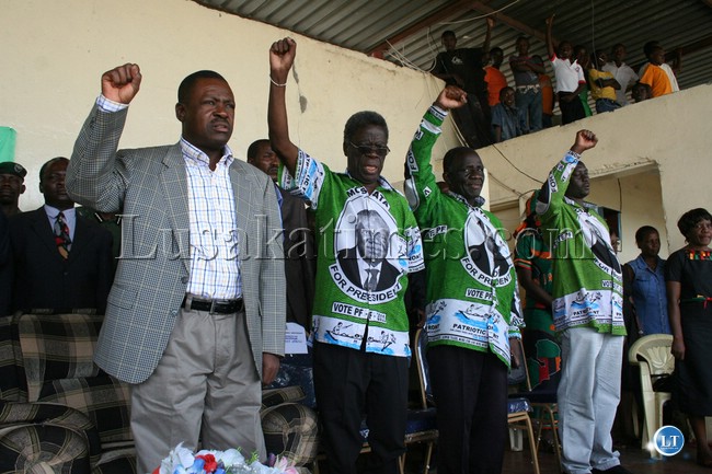 PF secretary general/ Justice minister winter kabimba with party officials waving party symbol during the 48th independencs celebrations in mongu yesterday PF secretary general/ Justice minister winter kabimba with party officials waving party symbol during the 48th independencs celebrations in mongu yesterday