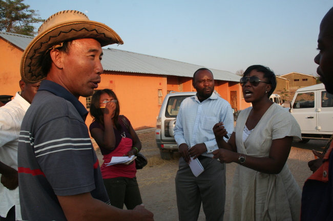 Central Province permanent secretary Anne Mwitwa, cautioning a chines supervisor working against mistreating Zambian workers Central Province permanent secretary Anne Mwitwa, cautioning a chines supervisor working against mistreating Zambian workers
