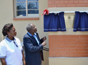 Health Minister Dr Joseph Kasonde unveils the plague to mark the official opening of the refurbished University Teaching Hospital Eye Centre of Excellence in Lusaka, Looking on is the head of eye clinic at UTH, Grace Mutati