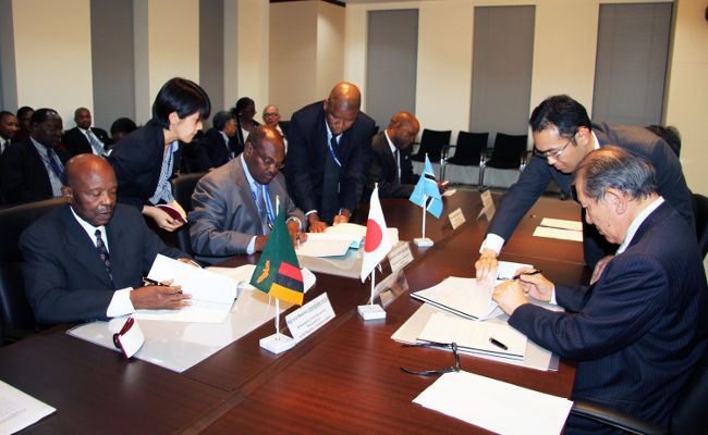 From left Zambia's Ambassador to japan Ng'ona Mwelwa Chibesakunda and Botswana minister of Finance and Development Planning Ontefetse Kenneth Matambo and JICA senior vice president Hideaki Dominichi signing the financing agreement to kick start the construction of the Kazungula bridge which include a railway line and the one stop border facility From left Zambia's Ambassador to japan Ng'ona Mwelwa Chibesakunda and Botswana minister of Finance and Development Planning Ontefetse Kenneth Matambo and JICA senior vice president Hideaki Dominichi signing the financing agreement to kick start the construction of the Kazungula bridge which include a railway line and the one stop border facility