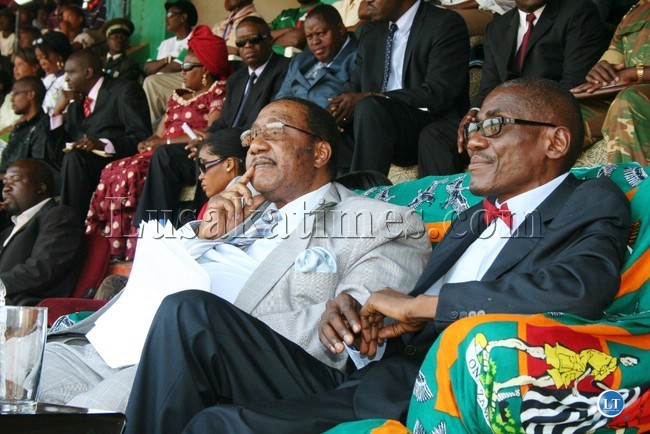 DEFENCE Minister, Geoffrey Mwamba ( l) and Eastern Province Minister, Charles Banda, watch dances during the celebration of independence at David Kaunda stadium in Chipata yesterday DEFENCE Minister, Geoffrey Mwamba ( l) and Eastern Province Minister, Charles Banda, watch dances during the celebration of independence at David Kaunda stadium in Chipata yesterday