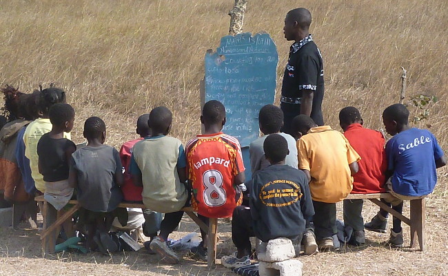 FILE: A class meets under a tree in Mwalubemba village, Zambia