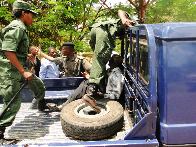 An identified Driver for a truck Registration Number ABV2596 being bundled in a Police van for ferrying cadres who wanted to disturb the PF Secretary General Wynter Kabimba official opening of the Party Provincial Indaba An identified Driver for a truck Registration Number ABV2596 being bundled in a Police van for ferrying cadres who wanted to disturb the PF Secretary General Wynter Kabimba official opening of the Party Provincial Indaba