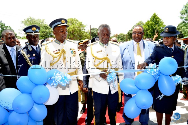 FILE: President Sata cuts a ribbon during the official opening of the newly constructed Livingstone ZAF Banquet Hall while ZAF Commander, Lieutenant General Eric Chimense and Defence minister Geoffrey Mwamba look on