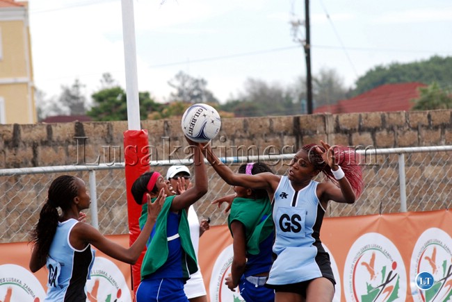 Botswana's Hildah Binang and Lesotho's Pabalo Rannetla fight for the ball during the SADC Under 20 Zone Six netball Games in Lusaka