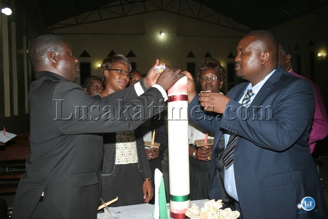 EASTERN Province Acting Deputy Permanent Secretary, Zachariah Luhanga (l) and Chipata District Commissioner, Kalunga Zulu (r) light a big candle during an inter-faith candle light service held at Reformed Church in Zambia ( RCZ) in Chipata EASTERN Province Acting Deputy Permanent Secretary, Zachariah Luhanga (l) and Chipata District Commissioner, Kalunga Zulu (r) light a big candle during an inter-faith candle light service held at Reformed Church in Zambia ( RCZ) in Chipata
