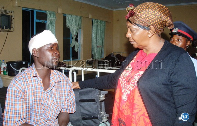 Mansa District Commissioner Mirriam Kauseni visiting one of the accident victims Fred Kalebwe who is nursing serious injuries in Serenje District Hospital Mansa District Commissioner Mirriam Kauseni visiting one of the accident victims Fred Kalebwe who is nursing serious injuries in Serenje District Hospital