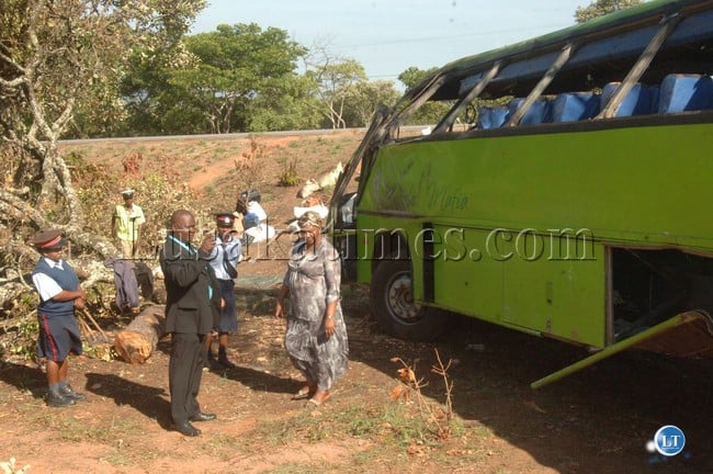 Serenje District Commissioner Charles Mwelwa and Mansa District Commissioner Mirriam Kauseni inspecting the accident scene after a bus accident where one person died on the spot and 47 others were injured Serenje District Commissioner Charles Mwelwa and Mansa District Commissioner Mirriam Kauseni inspecting the accident scene after a bus accident where one person died on the spot and 47 others were injured