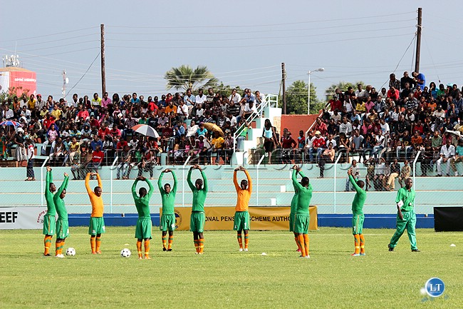 Zambian Under 20 mn's team stretching before a match