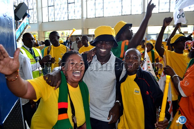 SOCCER fans mob Chipolopolo player Chisamba Lungu at the Kenneth Kaunda International Airport before departure for South Africa for the 2013 Africa Cup of Nations training camp SOCCER fans mob Chipolopolo player Chisamba Lungu at the Kenneth Kaunda International Airport before departure for South Africa for the 2013 Africa Cup of Nations training camp