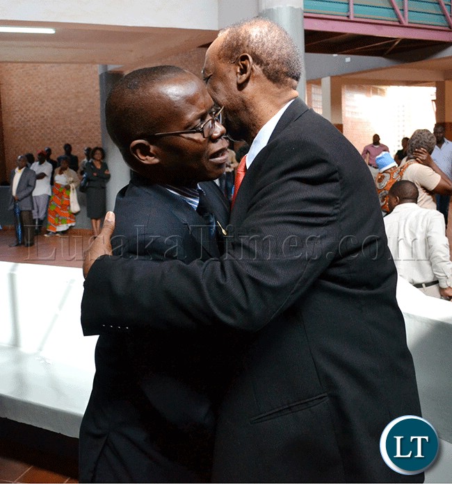 Former-Information-and-Broadcasting-Services-Minister-Ronnie-Shikapwasha-(right)-and-freelance-journalist-Chanda-Chimba-III-hug-at-the-Lusaka-magistrate-court-complex Former Information and Broadcasting Services Minister Ronnie Shikapwasha (right) and freelance journalist Chanda Chimba III hug at the Lusaka magistrate’s court complex