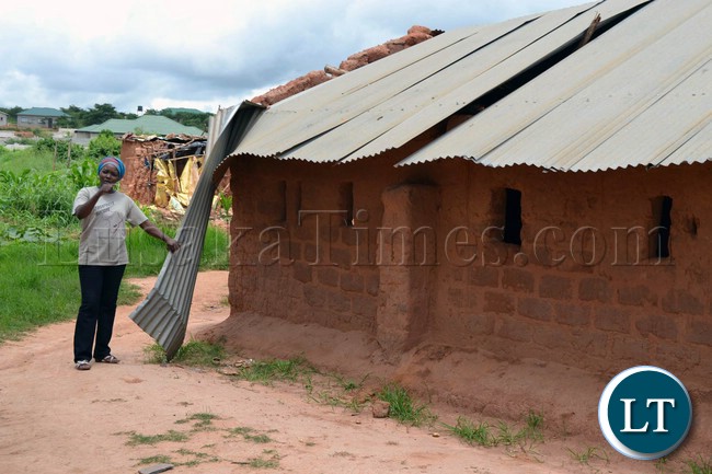 Mamgo Grove head teacher shows the Rotery Club members and the press some of the shoddily built classrooms that are apparently still in use