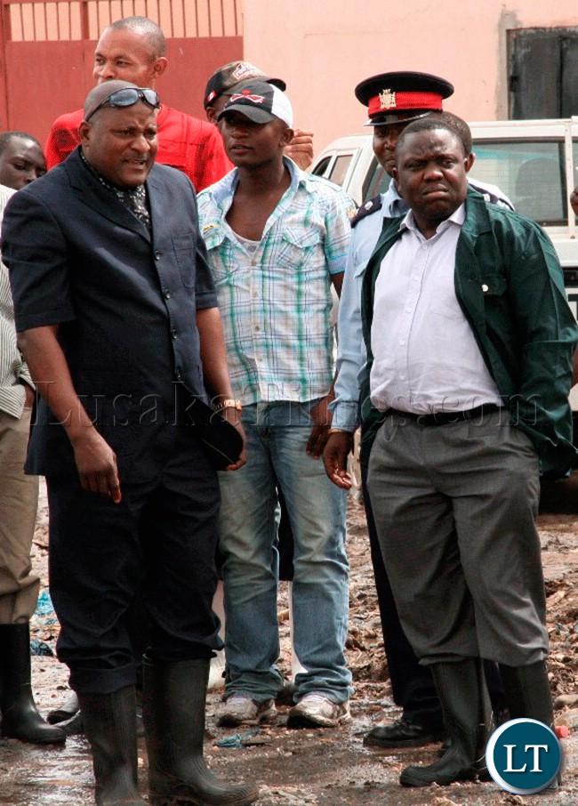 FILE: Deputy Minister in the VEEP Office Harry Kalaba (in Green top) and Lusaka District Commissioner Ashell Kapengele (in Blue suit) checks on the Njashishi and Chiparamba Roads of Kanyama Compound in Lusaka