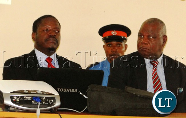 CITIZEN Economic Empowerment Commission (CEEC) Director General Likando Mukumbuta (left) explaining to Kasama prospective business men and women on how they can access Government empowerment funds at Northern Provincial Conference hall yesterday with Kasama District Commissioner Kalanga Bwalya (right).