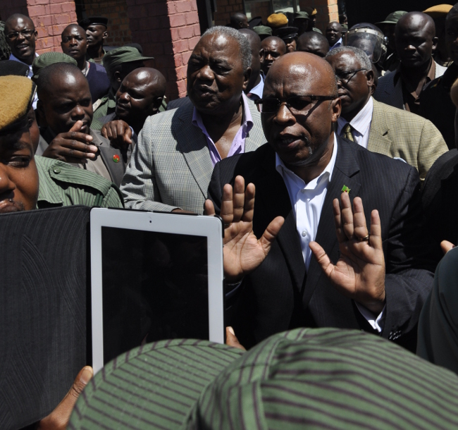 MMD president Nevers Mumba tries to control the crowd that gathered to show solidarity to Rupiah Banda at the DEC offices.