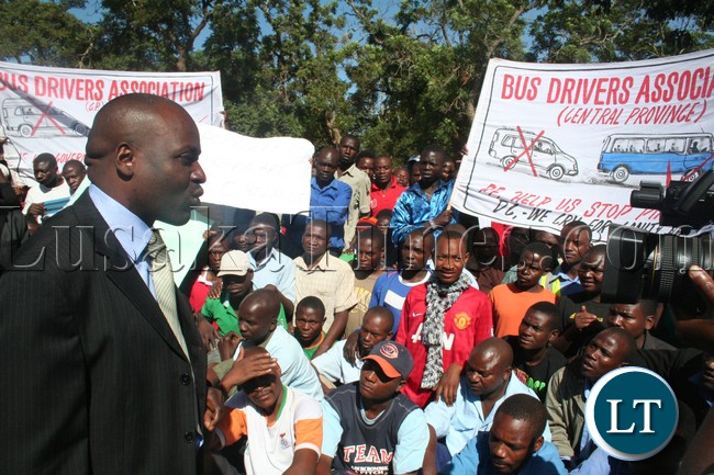 Kabwe Distrct Commissioner Patrick Chishala addressing the irate Minibus and Taxi Drivers at his Office when they stormed his Offices to register thier grievances over the the alleged loss of business due to the increased number of unregistered Taxies in Town