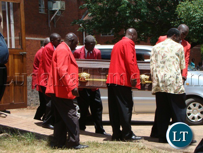PALL bearers carry the casket of late Patriotic Front Monze District Secretary Harrison Chanda suspected to be murdered during political campaigns at Livingstone general hospital