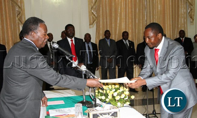 President Micheal Sata has advised politicians in the country to desist from practicing politics of violence,Picture the president during the Swearing in of Mr Richwell Siamunene UPND Mp as Deputy Minister Commerce, Trade ,and Industry at Statehouse 27-02-2013- picture by Eddie Mwanaleza/Statehouse.
