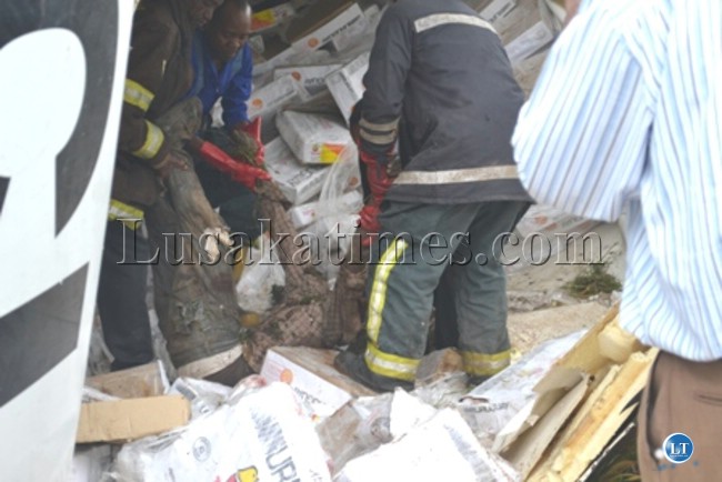 Rescue officers retrieving the body of the accident victim which occurred at Wusakile Roundabout