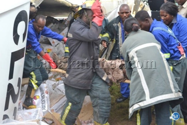 Rescue officers retrieving the body of the accident victim which occurred at Wusakile Roundabout