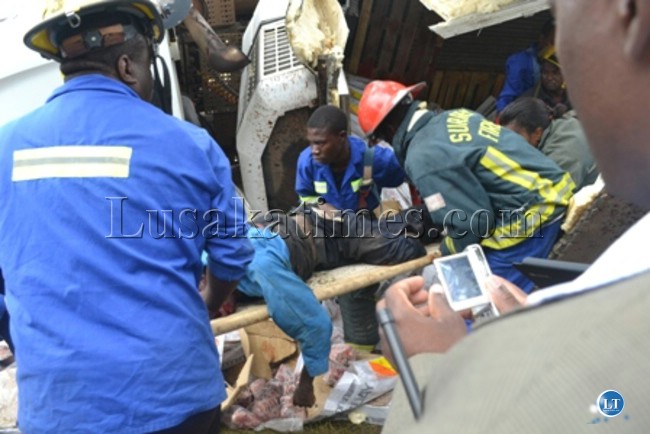 Rescue officers retrieving the body of the accident victim which occurred at Wusakile Roundabout
