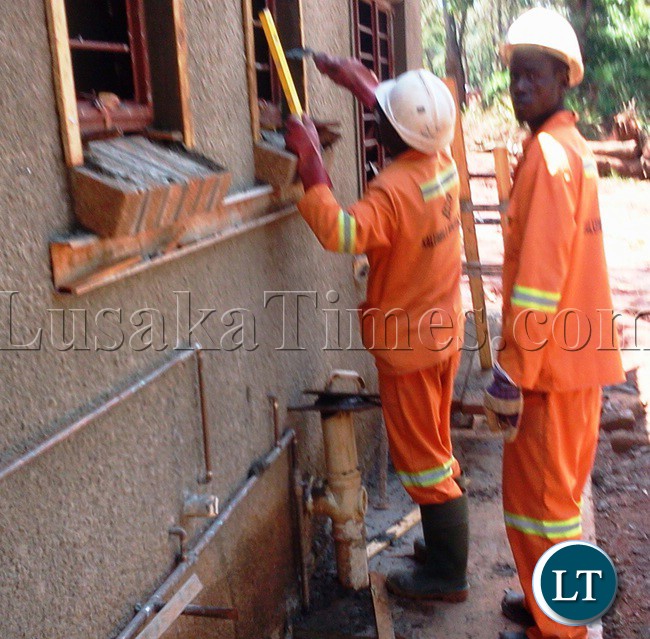 FIRST Quantum Minerals (FQM) is building a new town which will be located near its Trident Mining projects in Solwezi. Above, workers working on a window frame as a finishing touch to one of the model houses for 1,500 housing units the mining firm will build at the new town in Kalumbila area for its miners. The workers were captured during a tour by media heads and other senior journalists to Trident’s Sentinel Mine