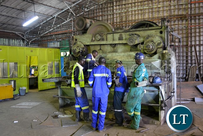 Workers at Nitrogen Chemicals of Zambia in Kafue manufacturing equipment parts in the fabrication workshop Workers at Nitrogen Chemicals of Zambia in Kafue manufacturing equipment parts in the fabrication workshop