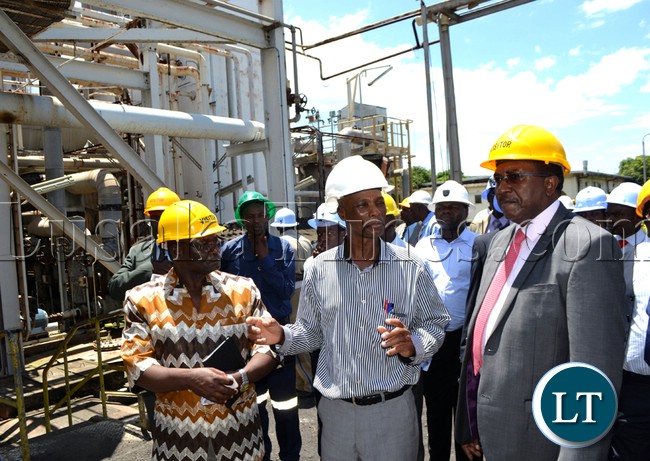 Nitrogen Chemicals of Zambia acting managing Director Zuze Banda (left) explains to Treasury to the Cabinet Fredson Yamba the operations and rehabilitation works currently taking place at the Kafue plant. This was when the Ministry of Finance and National Planning visited the plant on Wednesday to see how the company is utilizing the funds given to them by Government in August 2012 Nitrogen Chemicals of Zambia acting managing Director Zuze Banda (left) explains to Treasury to the Cabinet Fredson Yamba the operations and rehabilitation works currently taking place at the Kafue plant. This was when the Ministry of Finance and National Planning visited the plant on Wednesday to see how the company is utilizing the funds given to them by Government in August 2012